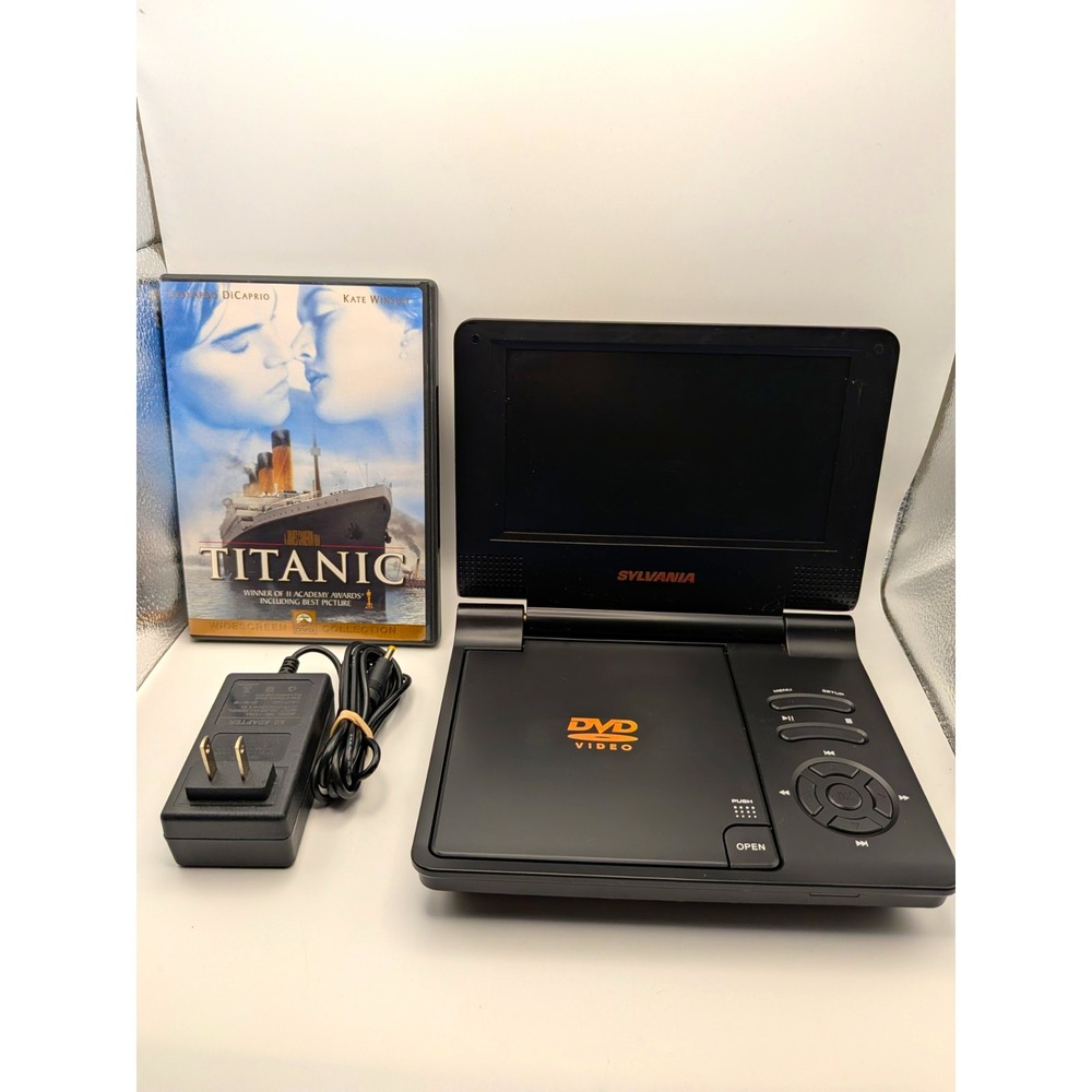 SYLVANIA Sylvania Portable DVD Player - DVD. FREE MOVIE.. (B)